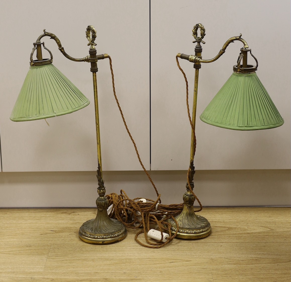 A pair of Louis XVI style gilt brass reading lamps, 66cm